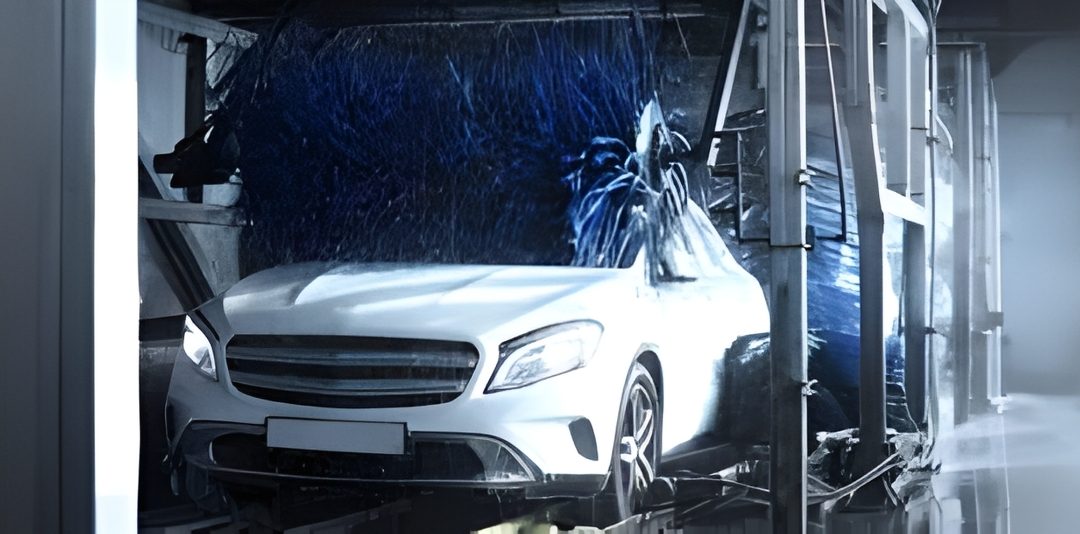 White sedan inside a crash-test rig undergoing a controlled collision in a lab environment